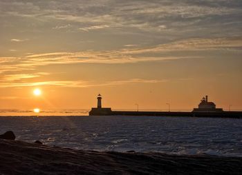 Scenic view of sea against sky during sunset