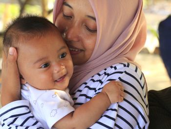 Midsection of mother and daughter