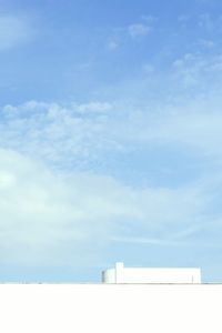 Low angle view of built structure against blue sky