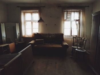 Empty chairs in abandoned building