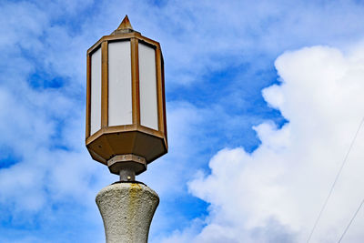 Low angle view of tower against blue sky