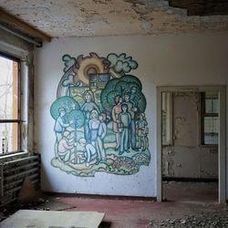 Graffiti on wall of abandoned house