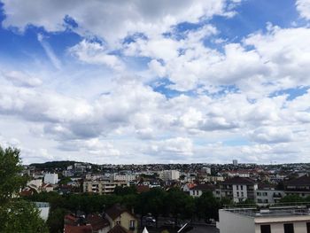 Houses in town against sky