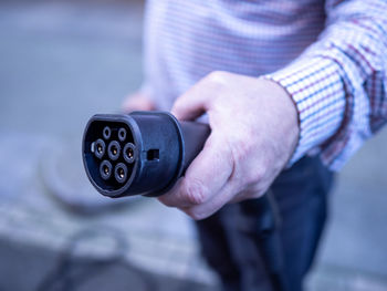 Close-up of man holding camera