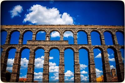 Low angle view of built structure against blue sky