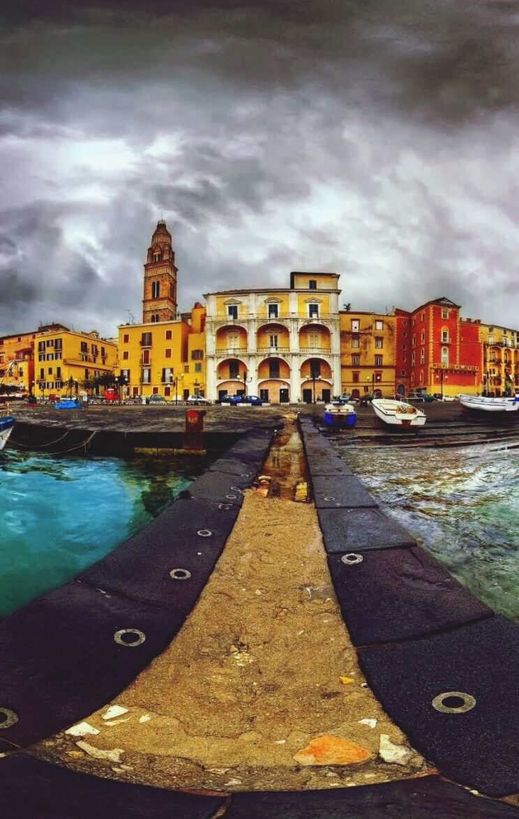 architecture, built structure, cloud - sky, sky, building exterior, cloudy, water, transportation, weather, cloud, city, bridge - man made structure, river, overcast, canal, outdoors, travel destinations, day, incidental people, connection