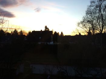 Built structure against sky at sunset