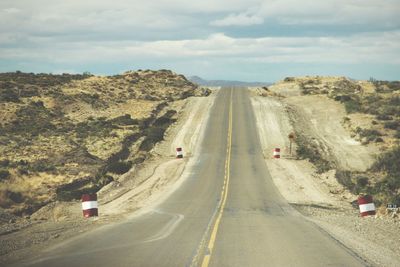 Road amidst landscape against sky