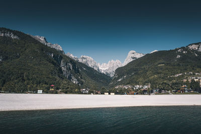 Scenic view of mountains against clear blue sky