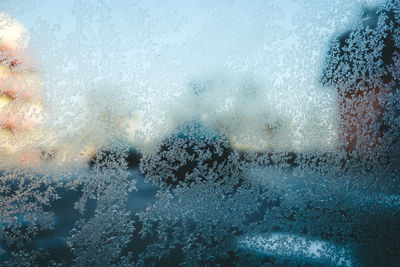 Full frame shot of wet glass window during rainy season