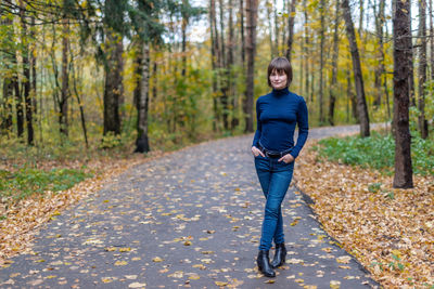 Portrait of woman on the road in forest