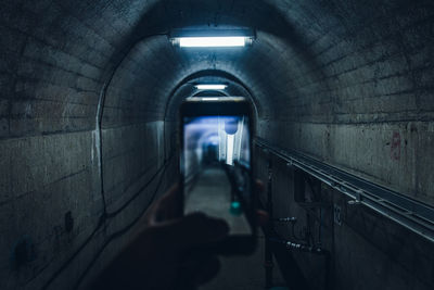 Man in  tunnel and shooting photos