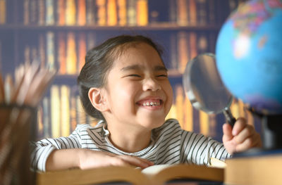 Portrait of a smiling girl looking at camera