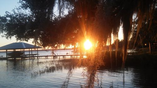 Scenic view of lake at sunset
