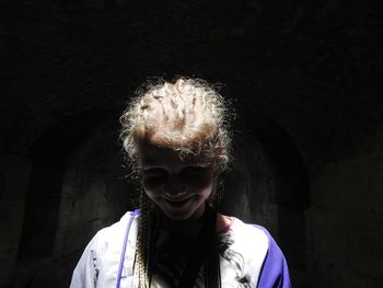 Portrait of smiling girl in tunnel