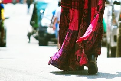 Low section of woman with umbrella