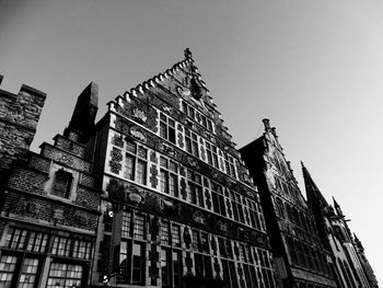 Low angle view of buildings against clear sky