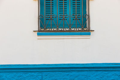 Low angle view of blue window of building
