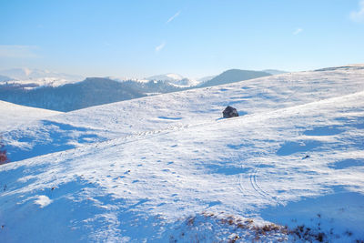 Sun over the winter mountains with snow, cindrel mountains, paltinis, romania