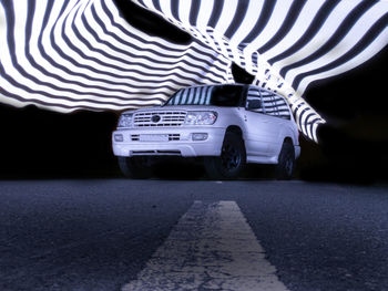 Car on road at night