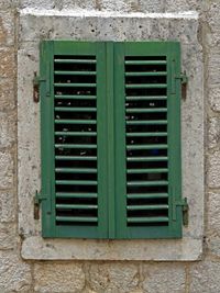 Close-up of window on wall of building