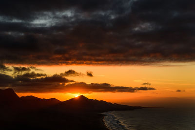 Scenic view of dramatic sky over sea during sunset at fuerteventura 