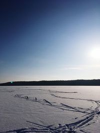 Scenic view of frozen landscape against clear sky