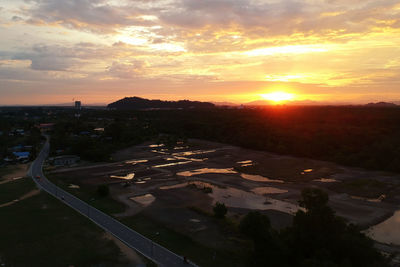 High angle view of cityscape against sky during sunset