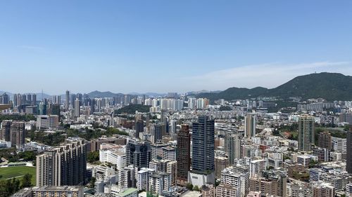 High angle view of modern buildings in city against sky