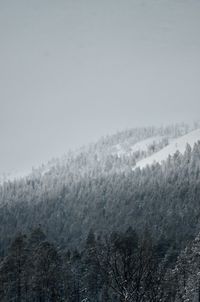Scenic view of snow covered mountains against sky