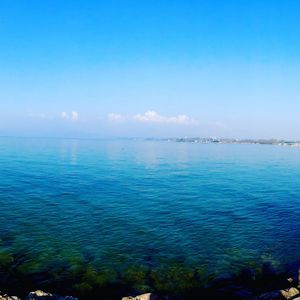 Scenic view of sea against blue sky