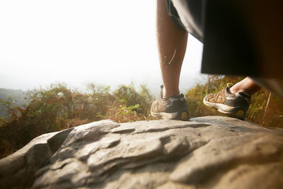 Low section of woman on rock