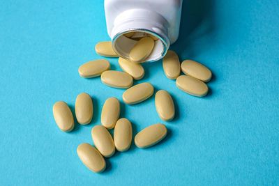 Close-up of pills on blue background
