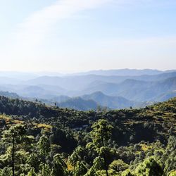 Scenic view of landscape and mountains against sky