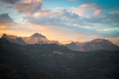 Scenic view of mountains against sky during sunset