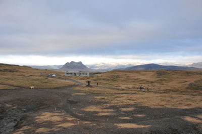 Scenic view of landscape and mountains against sky