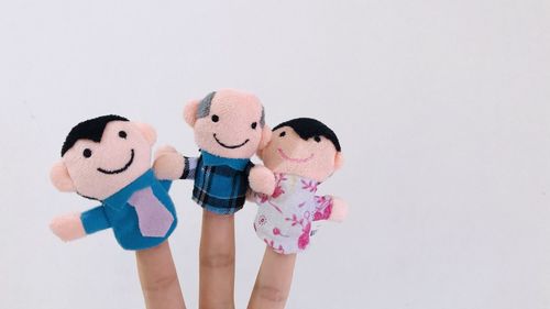 Close-up of doll against white background