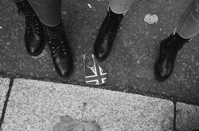 Low section of people standing on street