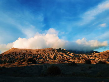 Scenic view of arid landscape against sky