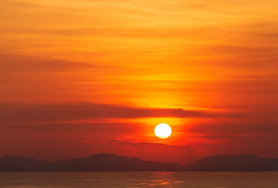 Scenic view of sea against romantic sky at sunset