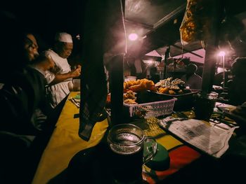 People in restaurant at night