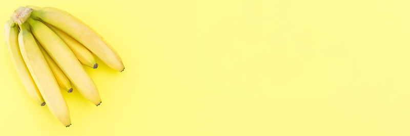 Close-up of yellow fruit over white background