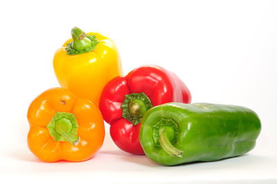 Close-up of bell peppers against white background