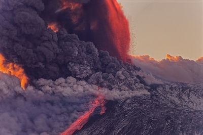 Scenic view of etna volcano eruption at sunset