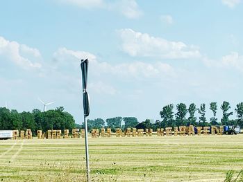 Scenic view of farm against sky