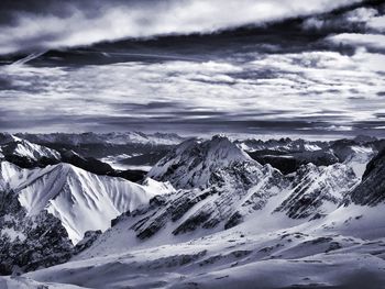 Scenic view of snowcapped mountains against sky