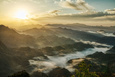 Scenic view of mountains against sky during sunset