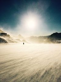 Scenic view of snowy landscape against sky during sunset