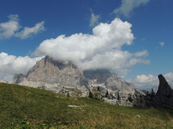 Scenic view of mountains against cloudy sky