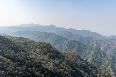 Misty mountain range covered with fog at morning from flat angle